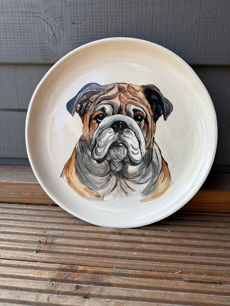 Unique pet portrait plate featuring a beautifully painted bulldog design on a ceramic plate.