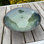Handmade green ceramic bowl in glossy seaweed and ocean blue colors, ideal for serving salads or as home decor.