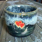 Handmade ceramic cup with hearts